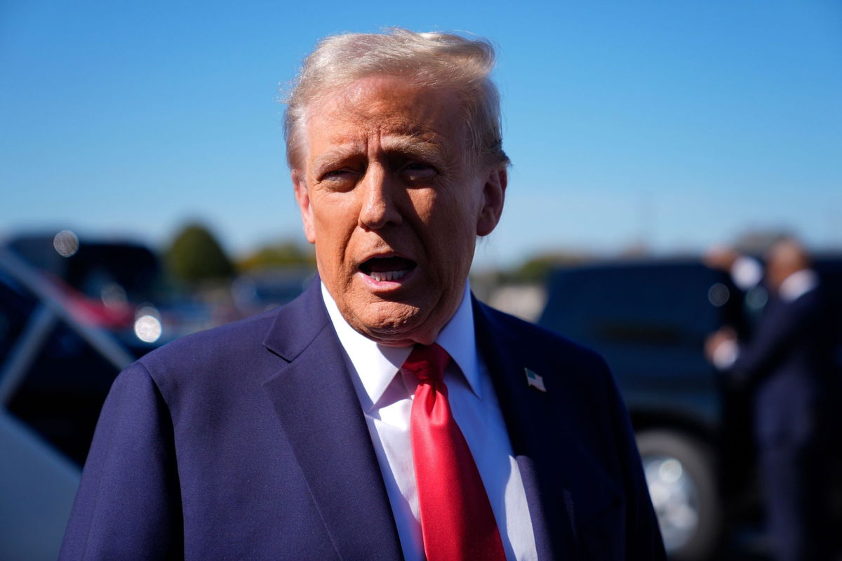 <i>Evan Vucci/AP via CNN Newsource</i><br/>Republican presidential nominee former President Donald Trump speaks with reporters upon arrival at Philadelphia International Airport