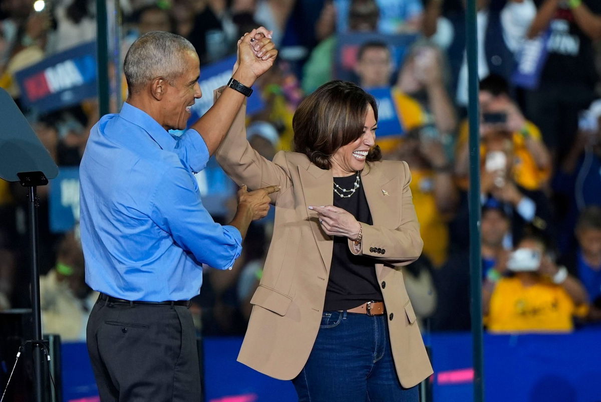 <i>Mike Stewart/AP via CNN Newsource</i><br/>Former President Barack Obama gestures after introducing Vice President Kamala Harris at a campaign rally in Clarkston