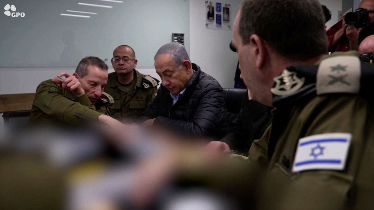 <i>GPO/Israeli army/Reuters via CNN Newsource</i><br/>Israeli Prime Minister Benjamin Netanyahu monitors the attack on Iran from an undisclosed location. Parts of the image were obscured by the Israel Defense Forces.