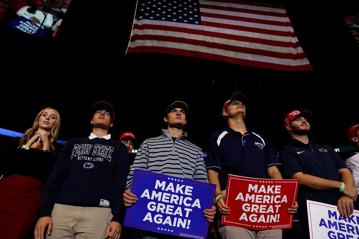 <i>Anna Moneymaker/Getty Images via CNN Newsource</i><br/>Supporters listen to former President Donald Trump during a campaign rally at Bryce Jordan Center in State College