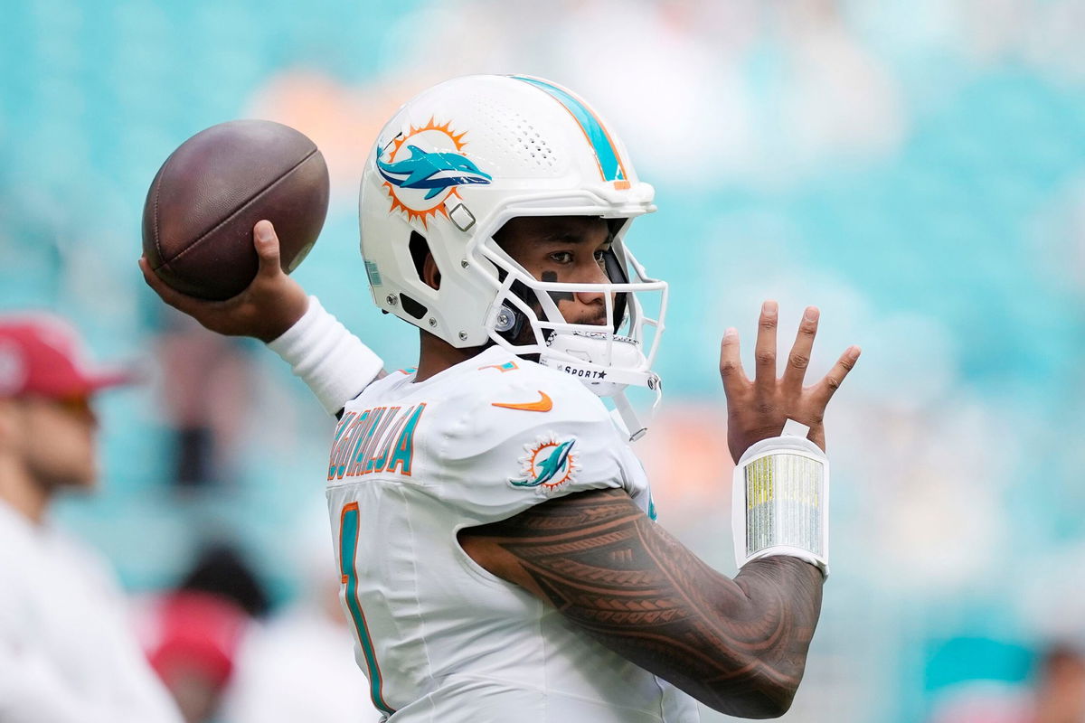 <i>Rebecca Blackwell/AP via CNN Newsource</i><br/>Miami Dolphins quarterback Tua Tagovailoa warming up before game against the Arizona Cardinals.