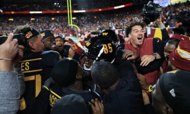 Washington Commanders players celebrate Noah Brown's game-winning Hail Mary touchdown catch to beat the Chicago Bears.