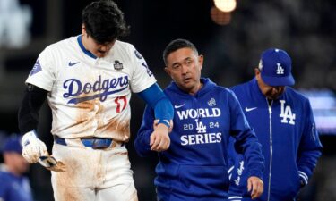 Shohei Ohtani is helped off the field after getting hurt during the seventh inning in Game 2 of the World Series against the New York Yankees.