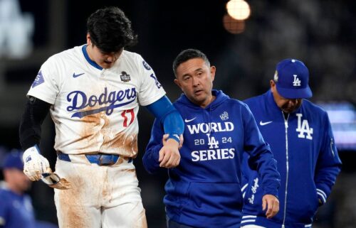 Shohei Ohtani is helped off the field after getting hurt during the seventh inning in Game 2 of the World Series against the New York Yankees.