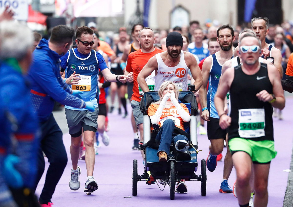 <i>Peter Morrison/AP via CNN Newsource</i><br/>Actor Colin Farrell ran the final 4 kilometers of the Irish Life Dublin Marathon 2024 while pushing close friend Emma Fogarty.