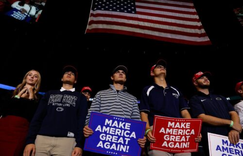 Supporters listen to former President Donald Trump during a campaign rally at Bryce Jordan Center in State College