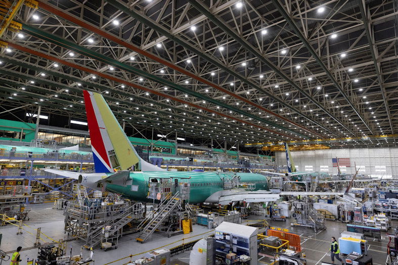 Boeing employees work on the 737 MAX on the final assembly line at Boeing's Renton plant, June 15, 2022, in Renton, Wash.