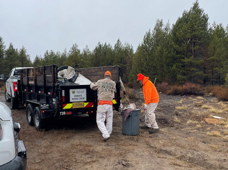 Deschutes County inmate work crew clears land of wildfire fuels in La Pine on Wednesday.