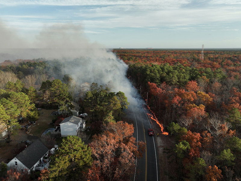 Several homes were evacuated as a wildfire spread through the Colliers Mills Wildfire Management Area in Ocean County, New Jersey.