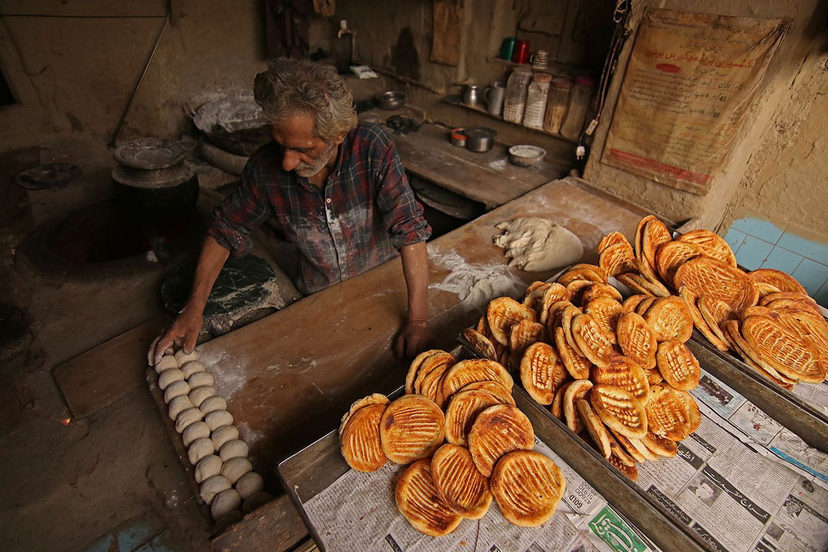 <i>Faisal Khan/Anadolu Agency/Getty Images via CNN Newsource</i><br/>A baker prepares bread in Srinagar