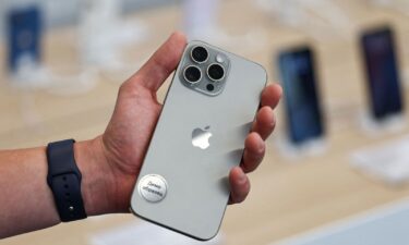 A man holds an Apple iPhone 16 Pro Max ahead of the launch of sales of the new iPhone 16 series smartphones in a store in Moscow