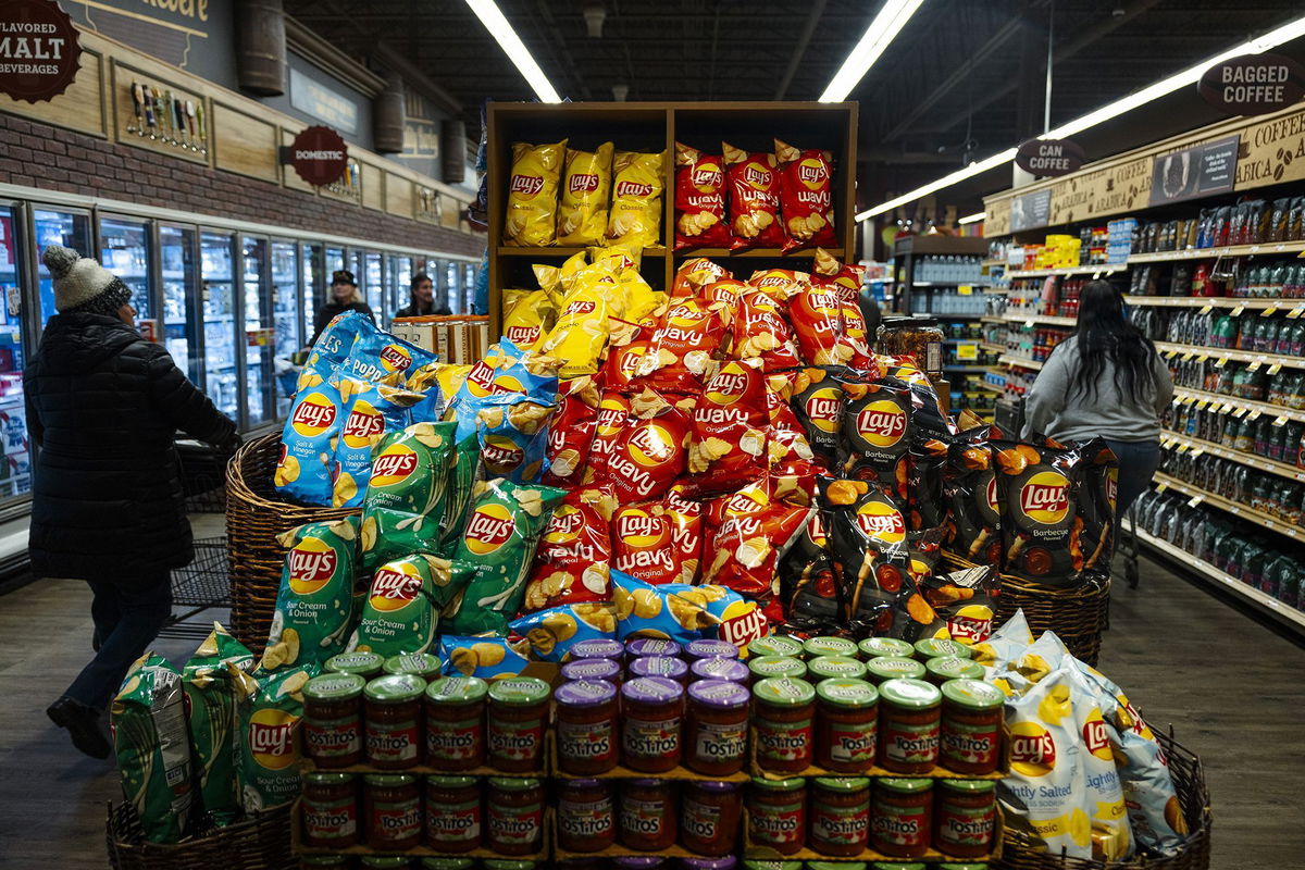 <i>Angus Mordant/Bloomberg/Getty Images via CNN Newsource</i><br/>PepsiCo Inc.'s FritoLay branded products at a supermarket in Latham