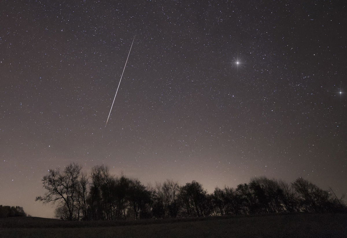 <i>Marko Korosec/Solent News/Shutterstock/File via CNN Newsource</i><br/>A meteor from one of the Taurid meteor showers streaks across the night sky over Slovenia's Brkini region in November 2015.