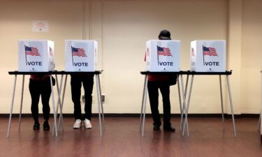 People cast their in-person early ballot for the 2024 general election at the Northwest Activities Center on October 29