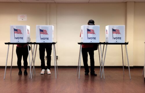 People cast their in-person early ballot for the 2024 general election at the Northwest Activities Center on October 29