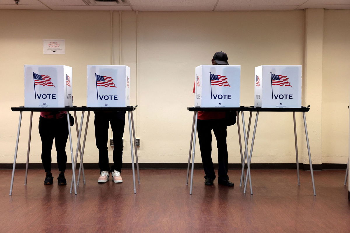 <i>Jeff Kowalsky/AFP/Getty Images via CNN Newsource</i><br/>People cast their in-person early ballot for the 2024 general election at the Northwest Activities Center on October 29