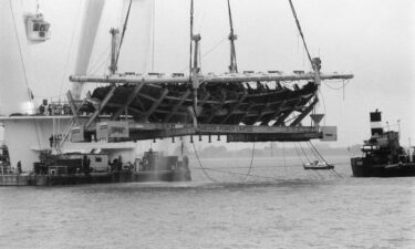 Excavators raise the hull of the 16th century English warship Mary Rose