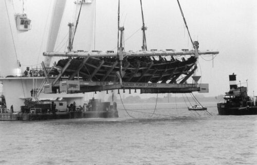 Excavators raise the hull of the 16th century English warship Mary Rose