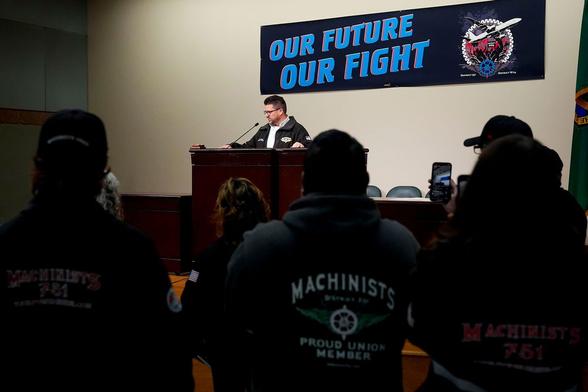 <i>Lindsey Wasson/AP via CNN Newsource</i><br/>IAM District 751 president Jon Holden speaks to union members while announcing that they voted to reject a new contract offer from Boeing on October 23.