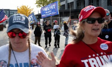 Trump supporters wait for the former president to speak at the Green Bay campaign rally on Wednesday