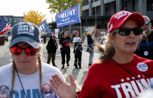 Trump supporters wait for the former president to speak at the Green Bay campaign rally on Wednesday