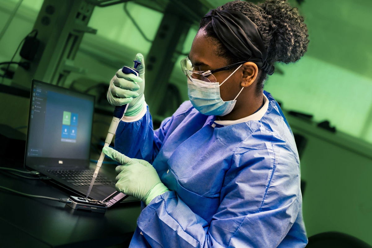 <i>Courtney Wheeler/CDC via CNN Newsource</i><br/>A public health scientist from the CDC's Enteric Diseases Laboratory Branch prepares a portable sequencing instrument for whole genome sequencing