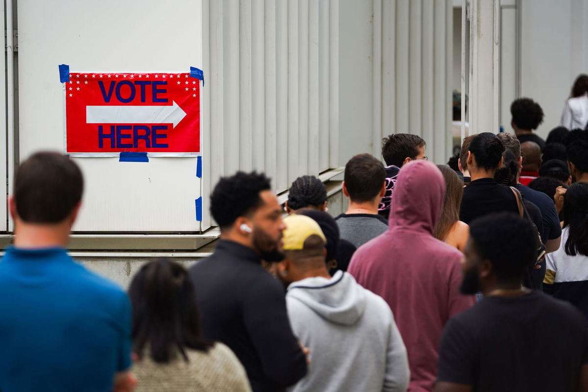 <i>Megan Varner/Getty Images via CNN Newsource</i><br/>Voters head into a polling location to cast their ballots in Atlanta