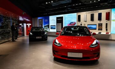 Tesla Model 3 cars are seen at a Tesla showroom at a shopping mall in Beijing on April 29