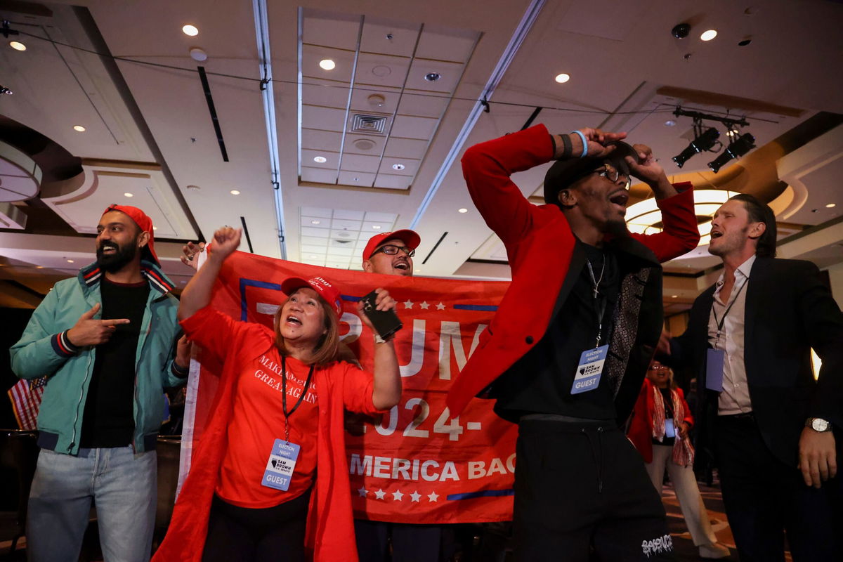 <i>Ian Maule/AP via CNN Newsource</i><br/>Trump supporters cheer election results in Las Vegas.