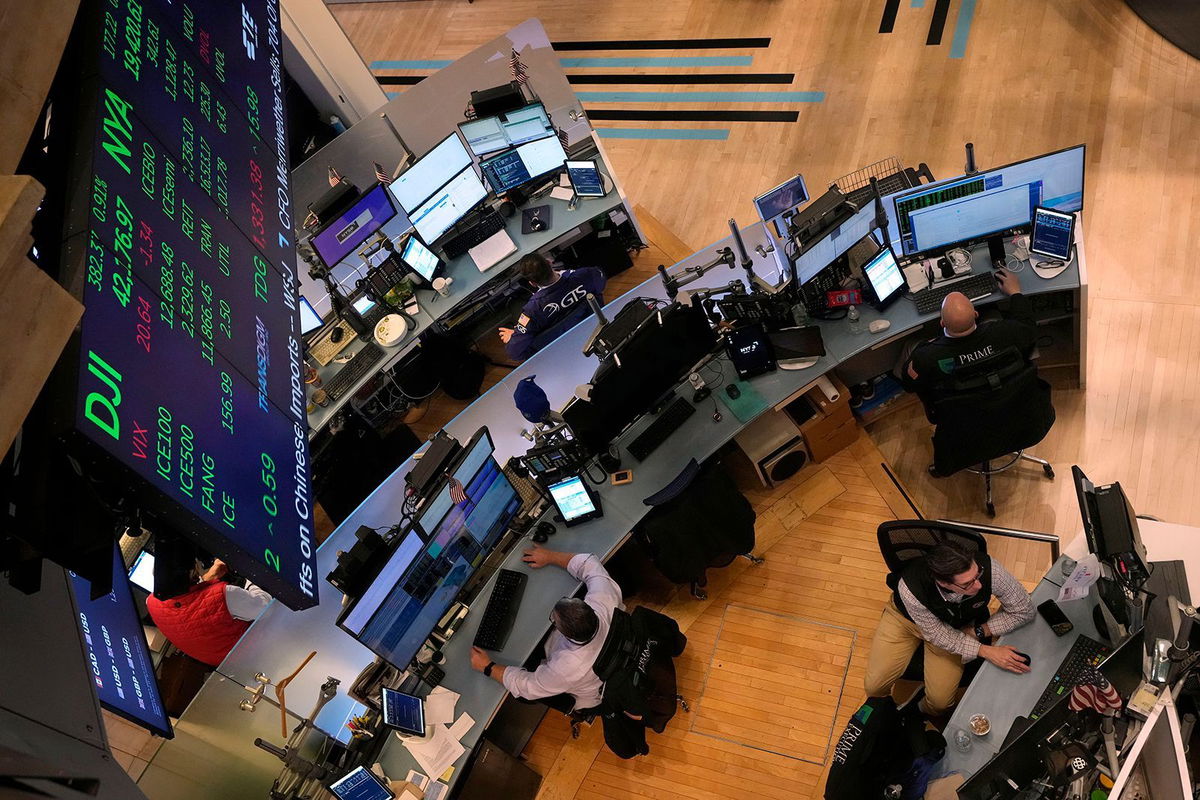 <i>Richard Drew/AP via CNN Newsource</i><br/>Traders work on the floor of the New York Stock Exchange on Tuesday