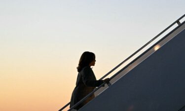 Vice President Kamala Harris makes her way to board Air Force Two before departing Dane County Regional Airport in Madison