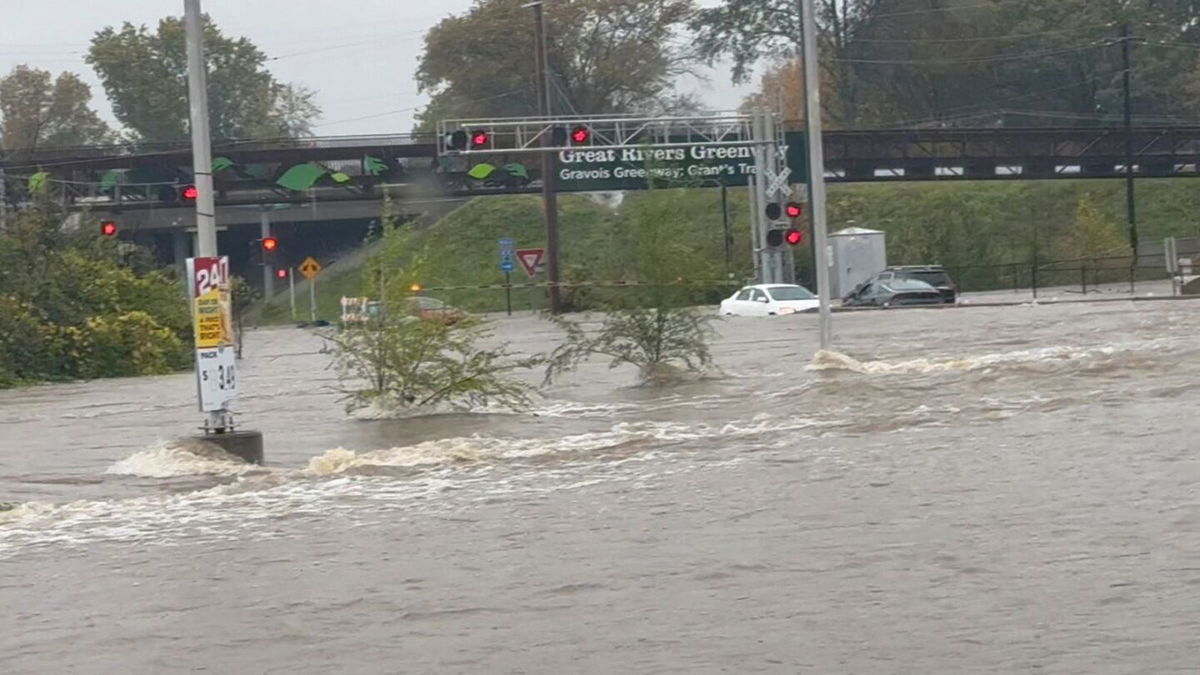 <i>a._knm/Instagram/Reuters via CNN Newsource</i><br/>Vehicles are partially submerged by floodwaters caused by heavy rain in St. Louis on Tuesday