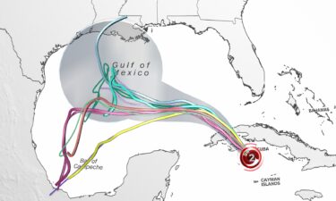 Different forecast model solutions (colored lines) for Rafael's track are overlaid on the official forecast cone (grey) from the National Hurricane Center. The storm's uncertain track has been trending west