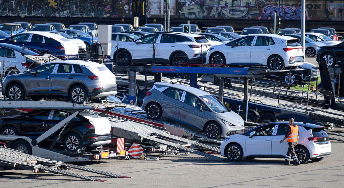 <i>Hendrik Schmidt/picture-alliance/dpa/AP via CNN Newsource</i><br/>Vehicles are loaded onto car carriers at the Volkswagen plant in Zwickau