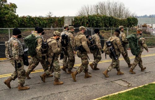 Washington National Guard personnel walk on the Washington State Capitol campus on January 20