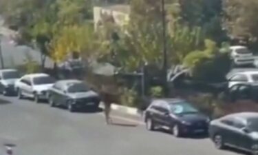 Video shared on social media shows the woman in Tehran walking down a road