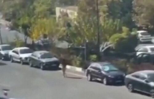 Video shared on social media shows the woman in Tehran walking down a road