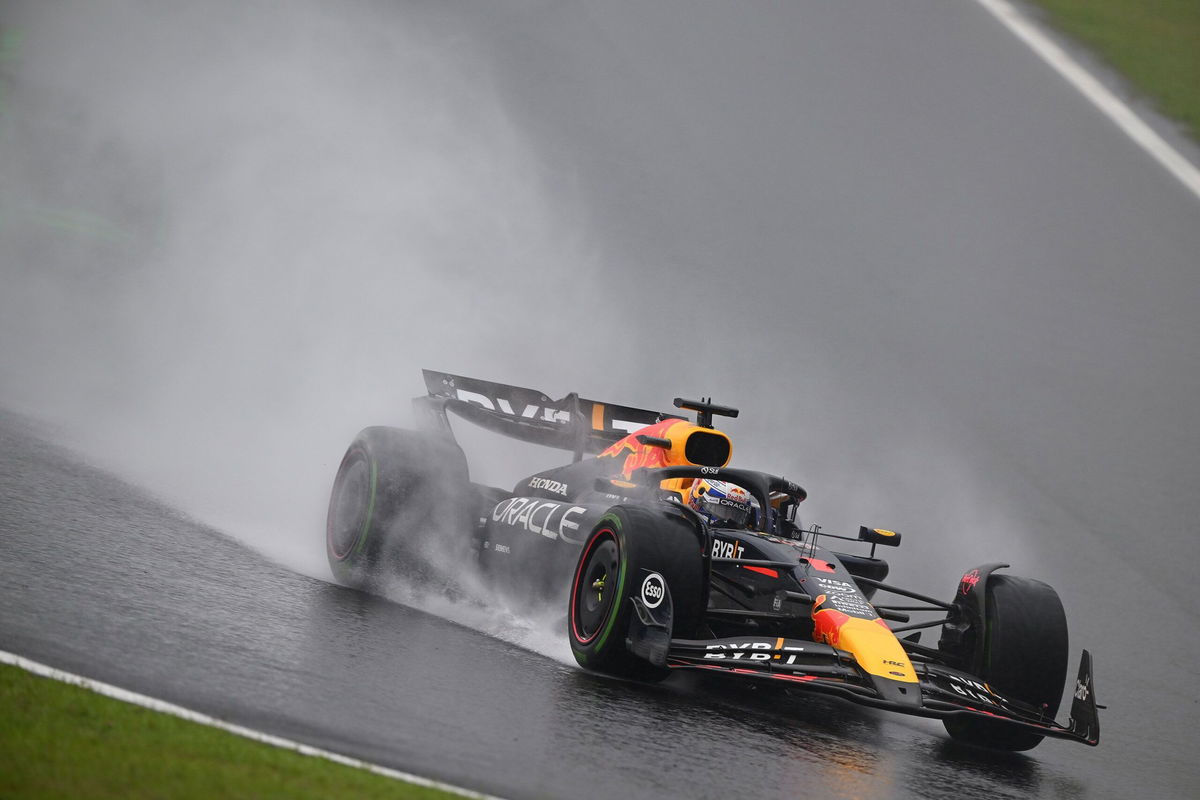 <i>Clive Mason/Getty Images via CNN Newsource</i><br/>Rain kicks up off the back of Verstappen's car as he competes during the Sao Paulo Grand Prix.