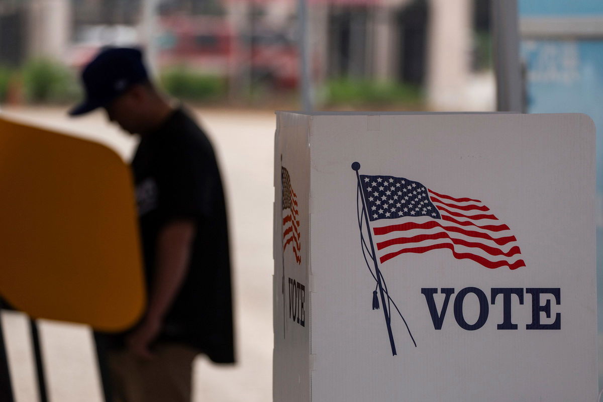 <i>Qian Weizhong/VCG/AP via CNN Newsource</i><br/>A voter casts ballot during the early voting process at a polling station ahead of the upcoming 2024 presidential election on October 27