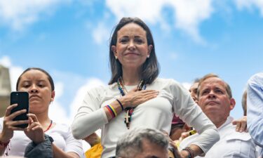 Opposition leader Maria Corina Machado looks on with a hand in her chest during a protest against the result of the presidential election on July 30 in Caracas