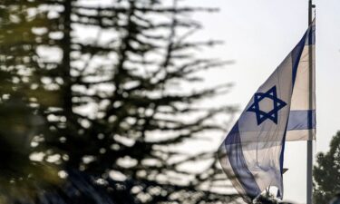 An Israeli flag flies outside the Prime Minister's Office in Jerusalem on October 22.