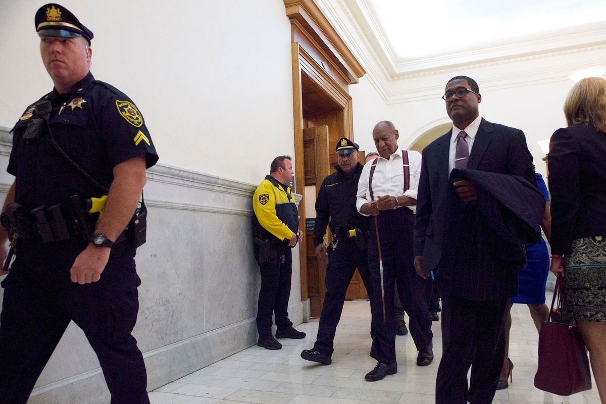 <i>Mark Makela/Getty Images via CNN Newsource</i><br/>Bill Cosby is taken away in handcuffs after being sentenced to three to 10 years in his sexual assault retrial in September 2018 in Norristown