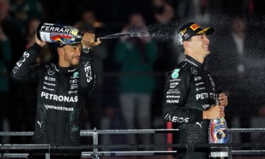 The Mercedes duo of Hamilton and Russell celebrate on the podium.