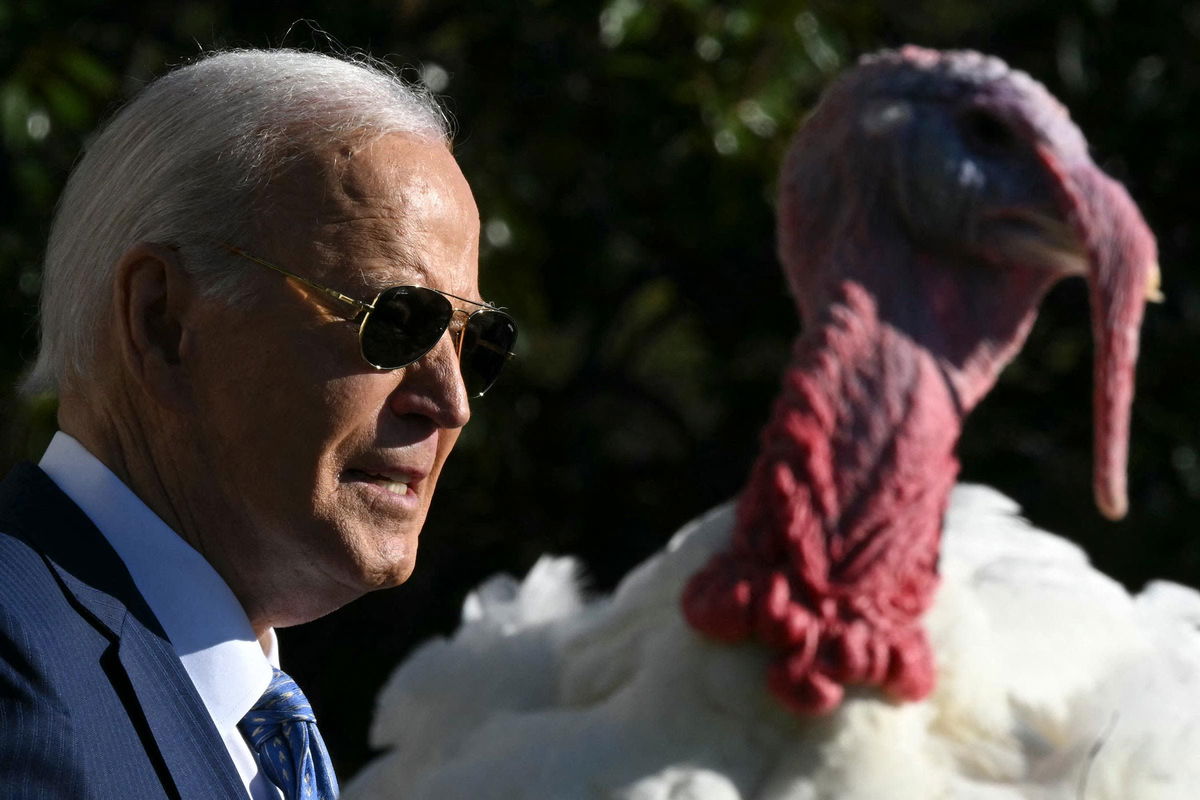 <i>Drew Angerer/AFP/Getty Images via CNN Newsource</i><br/>President Joe Biden pardons the National Thanksgiving Turkeys Peach and Blossom during an event on the South Lawn of the White House in Washington