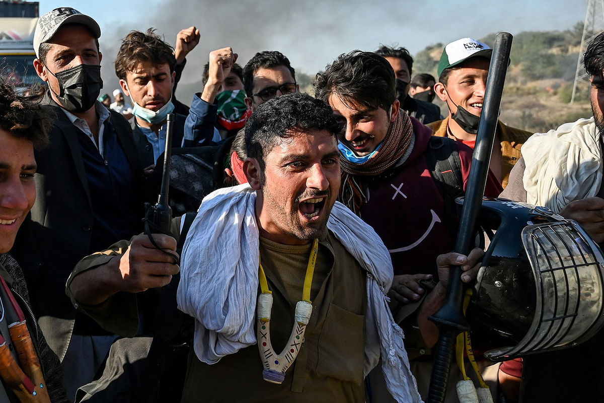 <i>Aamir Qureshi/AFP/Getty Images via CNN Newsource</i><br/>Pakistan Tehreek-e-Insaf (PTI) party's supporters shout slogans as they protest to demand the release of former prime minister Imran Khan