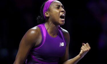 Coco Gauff lifts the Billie Jean King Trophy after winning the WTA Finals in Riyadh