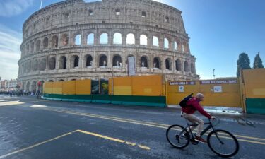 A cyclist in front of Rome's Colosseum on October 18.