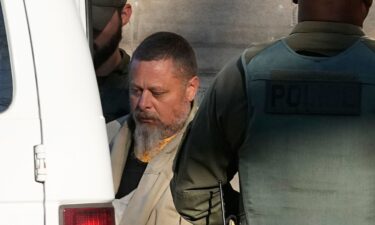 Officers escort Richard Allen out of the Carroll County courthouse following a hearing