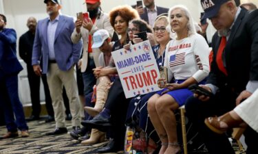 People listen as Trump participates in a roundtable discussion at the Latino Summit held at Trump National Doral Golf Club on October 22