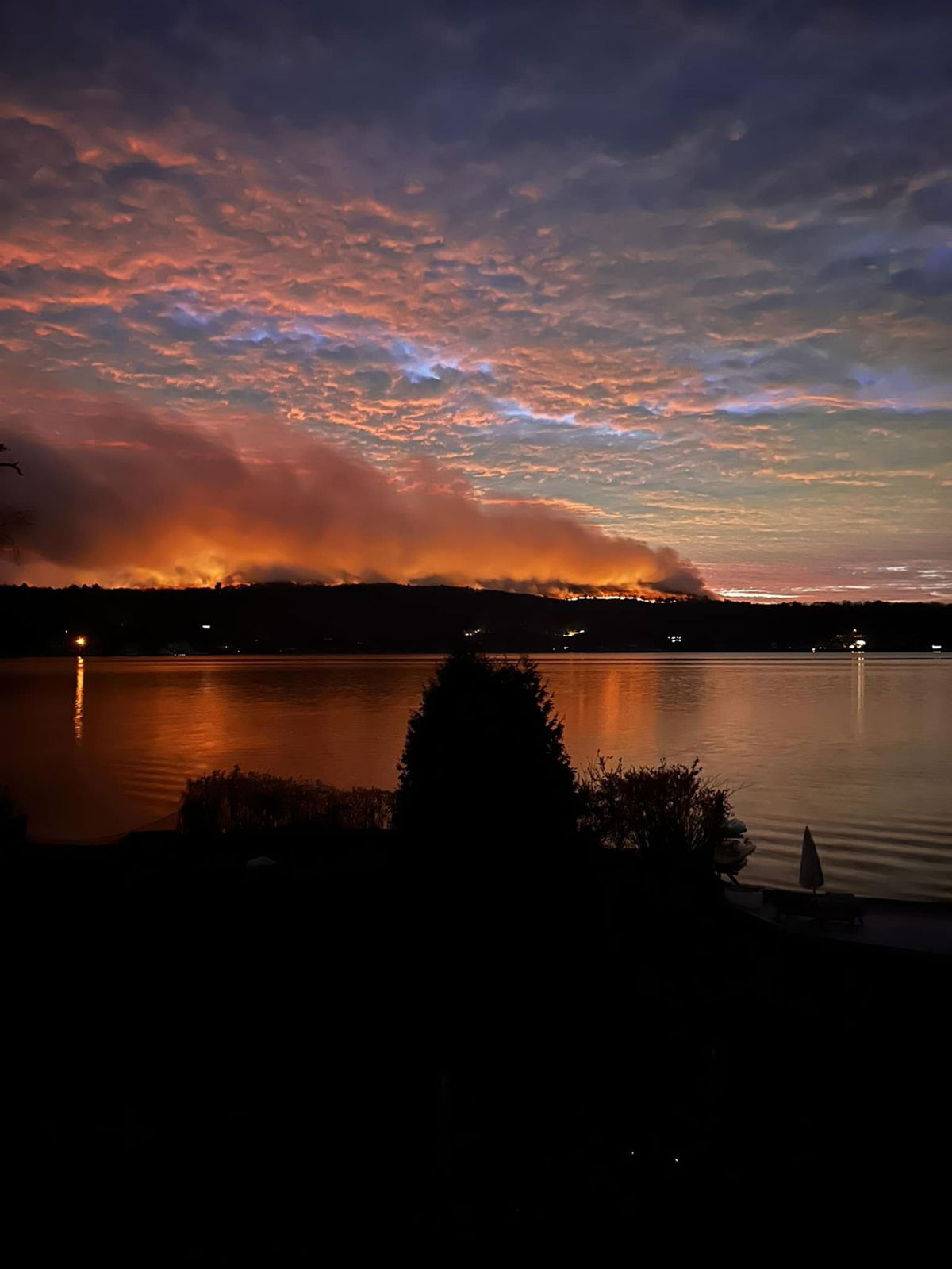 <i>Andrew Meher via CNN Newsource</i><br/>Plumes of smoke drift off from the Jennings Creek Wildfire along the New York-New Jersey border on Sunday.